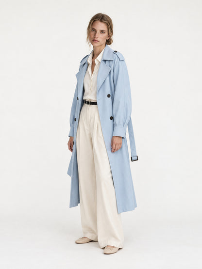 Sky blue belted trench coat MJ272606, worn open with cream trousers