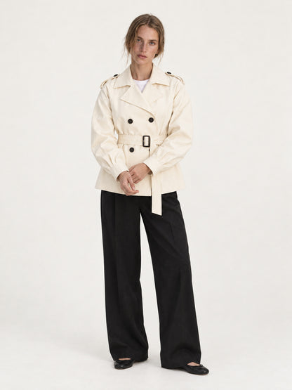 Beige short belted trench MJ272607, worn buttoned and belted