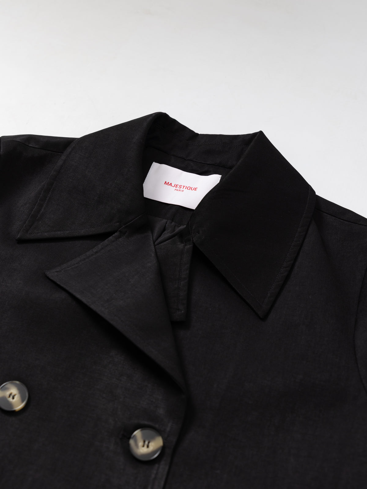 Black short trench jacket MJ275002, collar and label detail