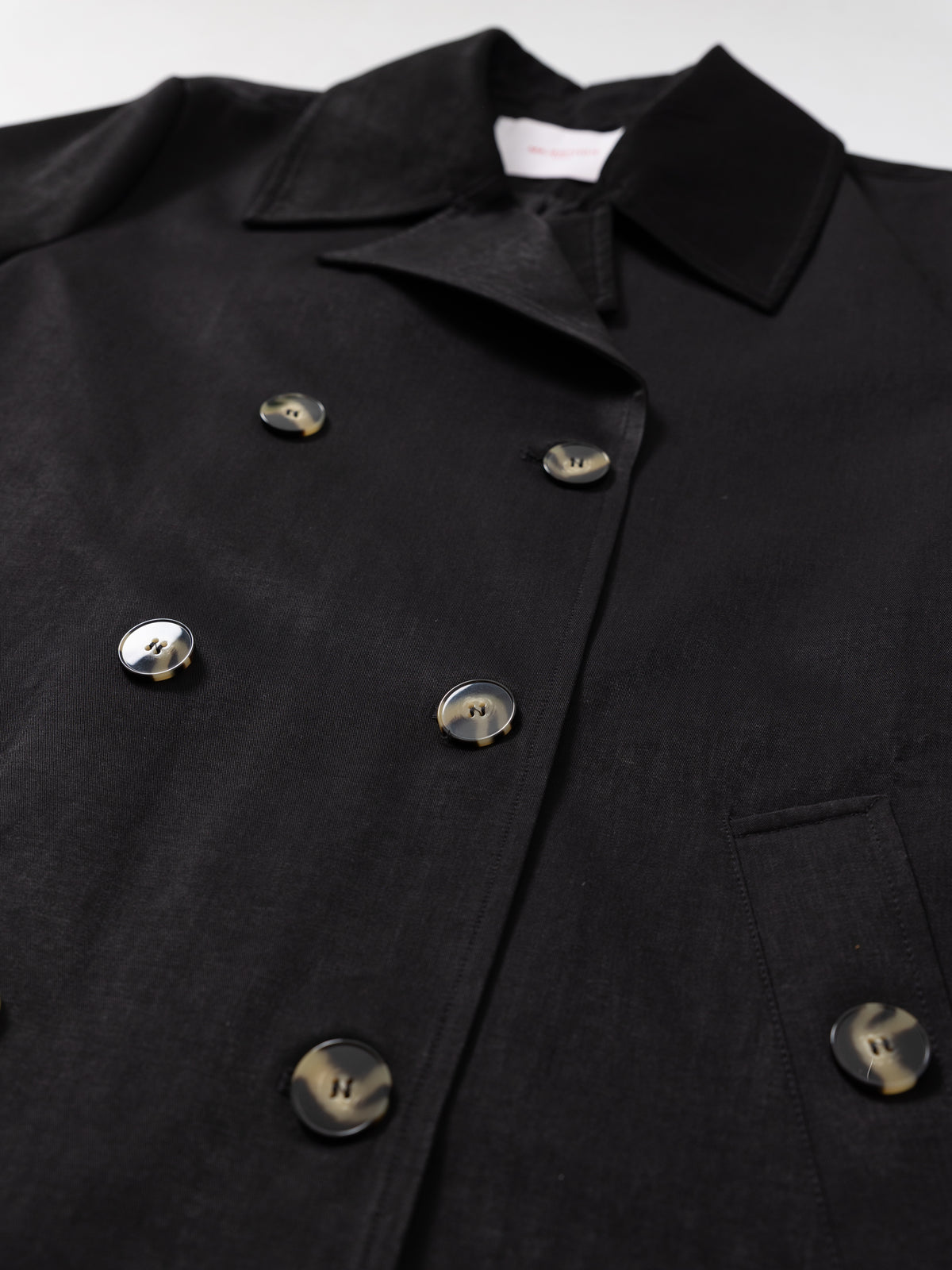 Black short trench jacket MJ275002, button and pocket detail