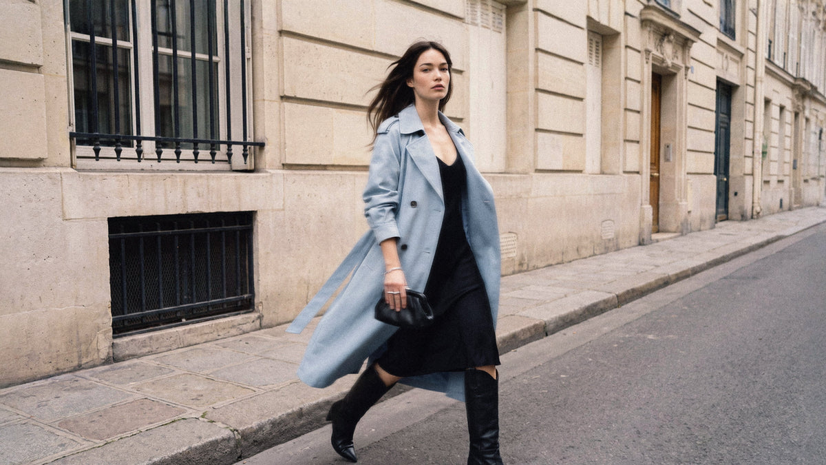 Woman walking down a Parisian street in a sky blue Majestique Paris trench coat